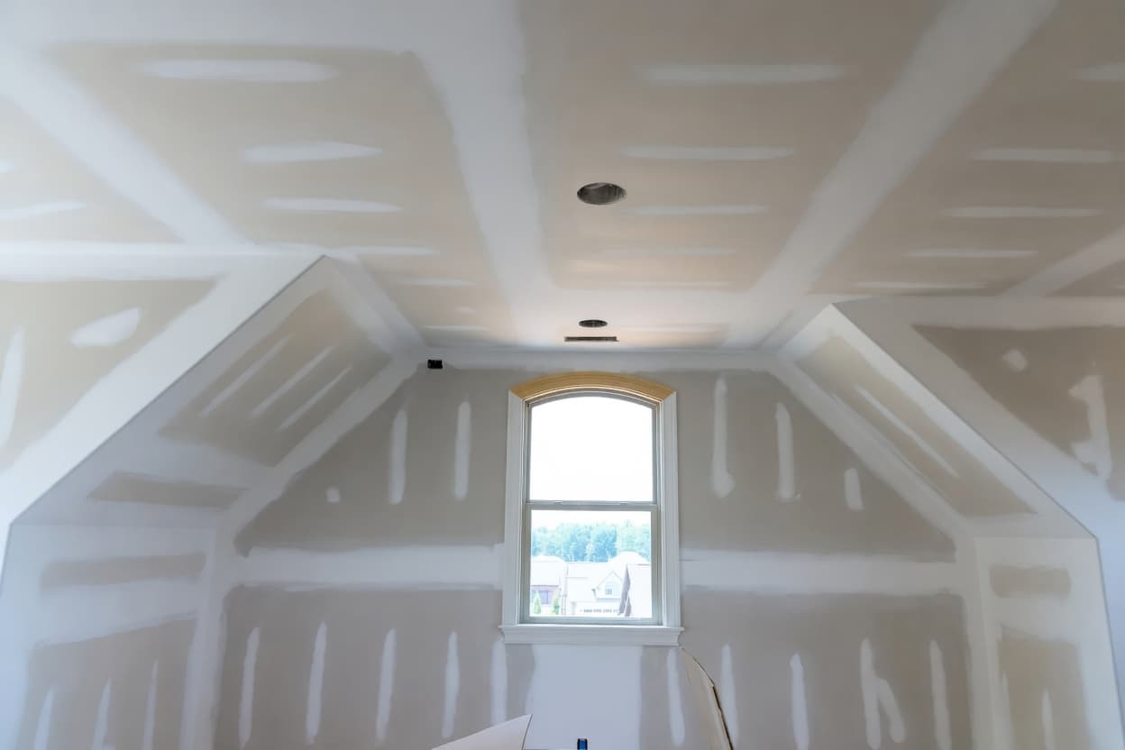 Precision tape and mud work in attic conversion