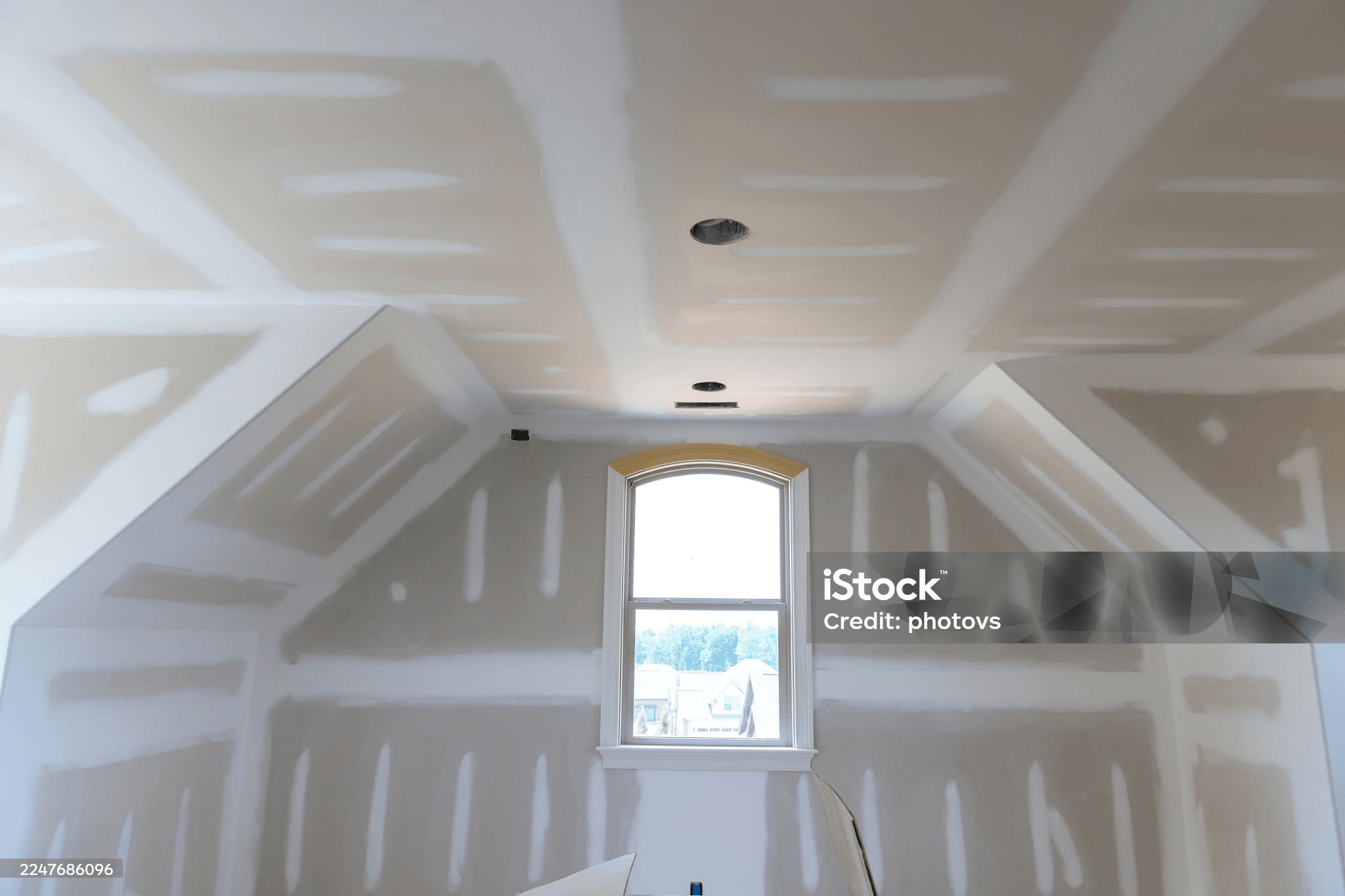Precision tape and mud work in attic conversion